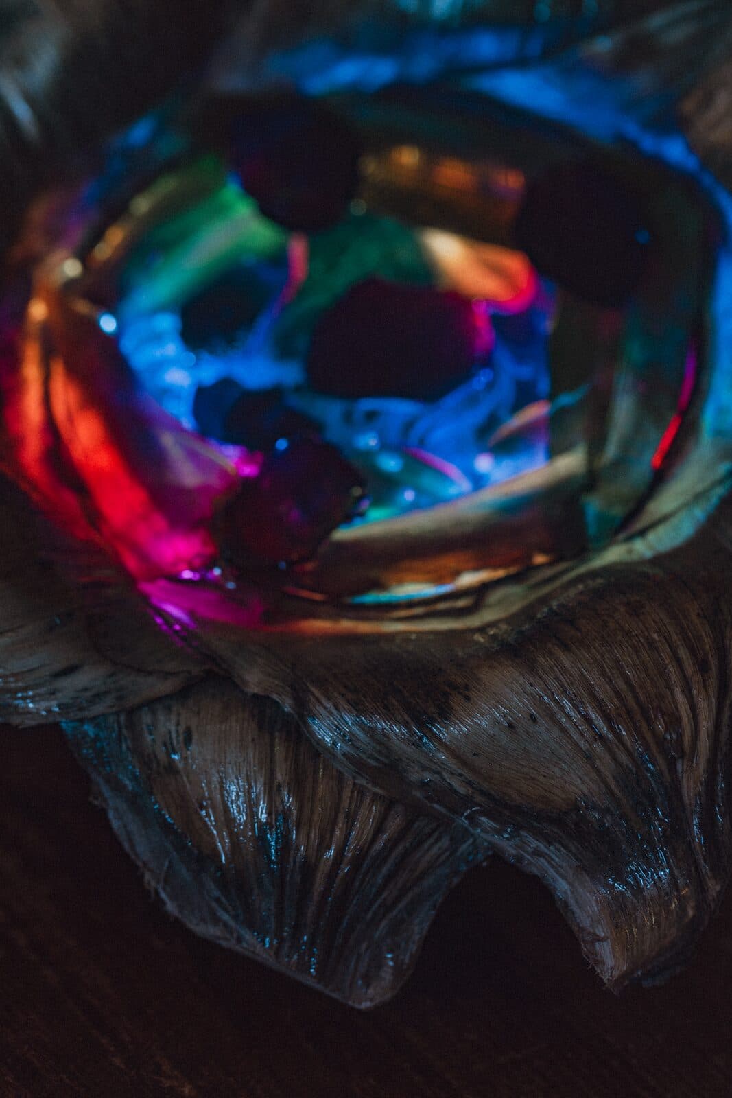 Glowing close-up of an Eluztres lamp in the dark
